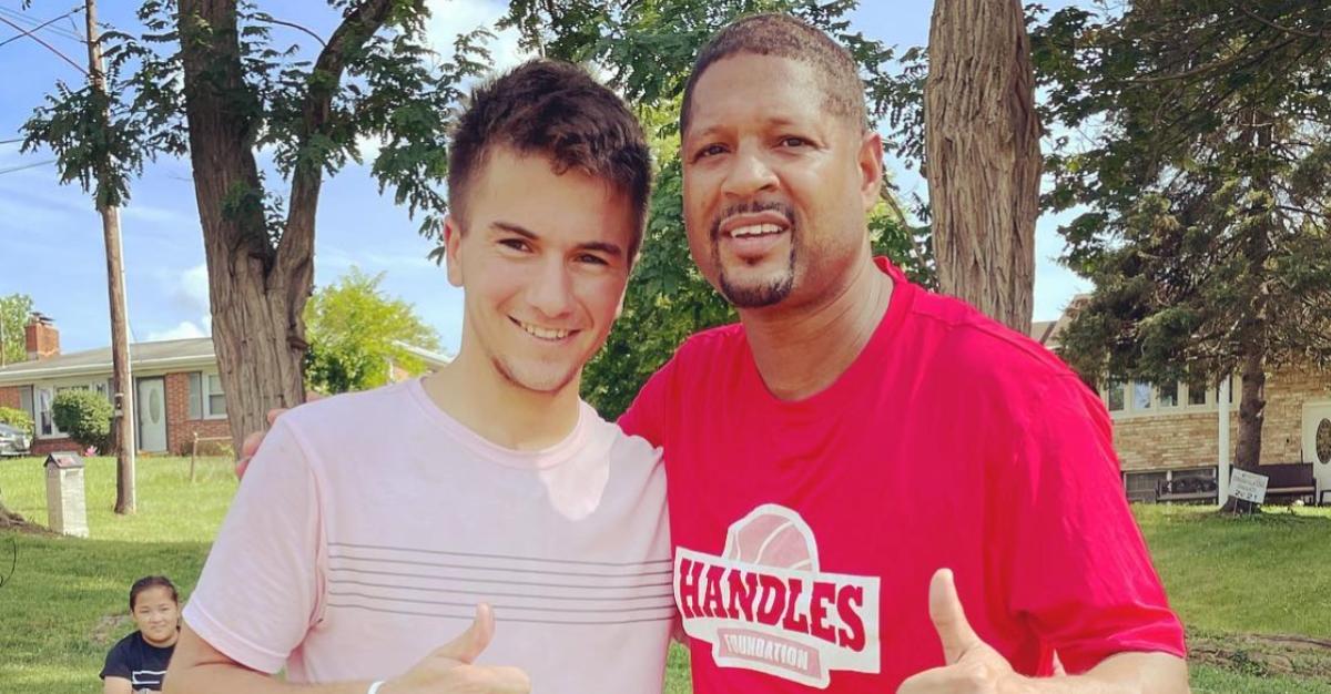 Kenneth From 'Return to Amish' poses with a Harlem Globetrotter basketball player for an Instagram photo