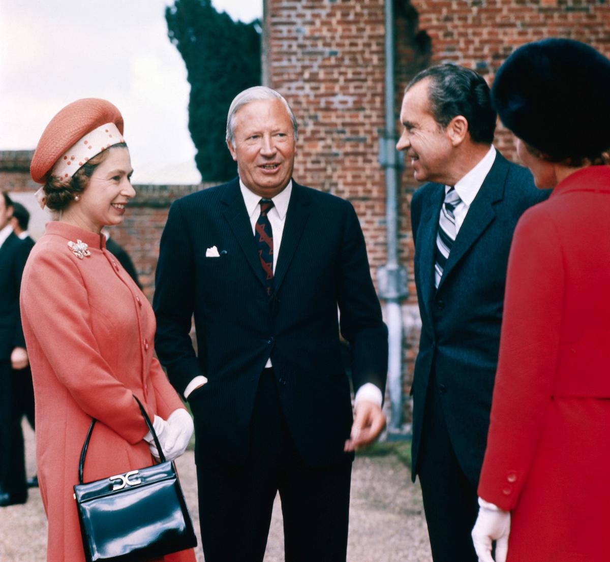 Why Does the Queen Carry Her Handbag Indoors? What's Inside?