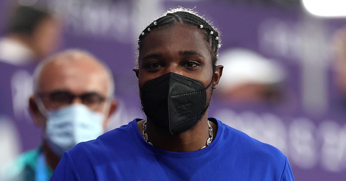 Noah Lyles in a mask after the 200m finals. 