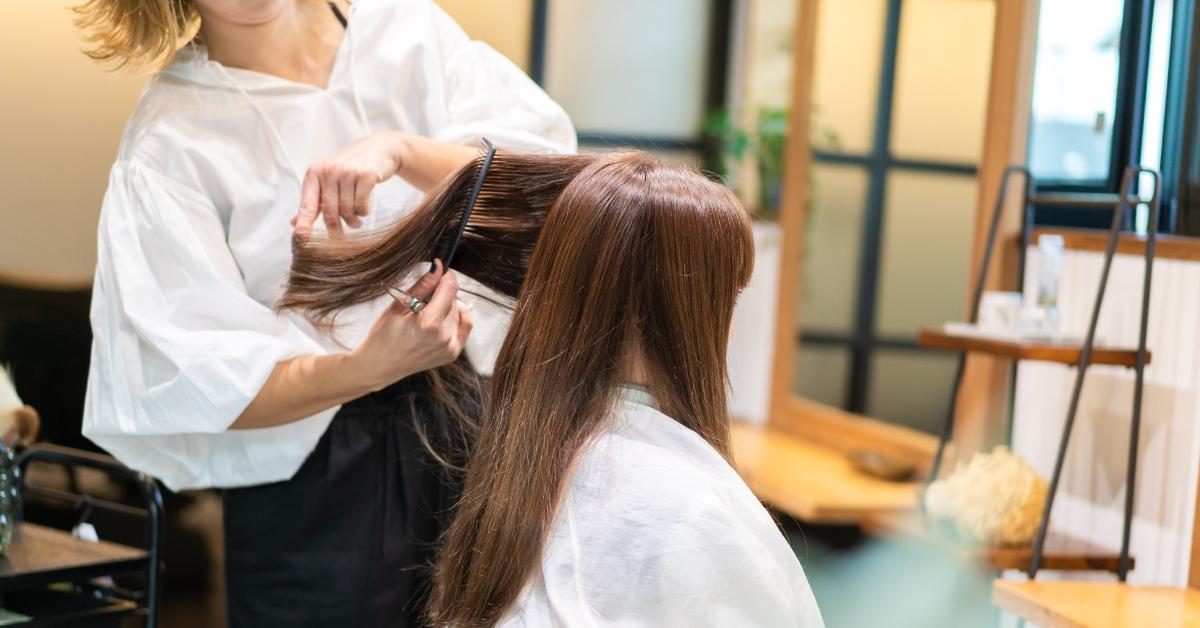 woman at hair salon getting hair cut