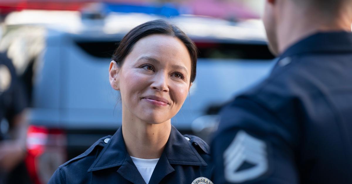 Lucy smiling at Tim on 'The Rooke'.