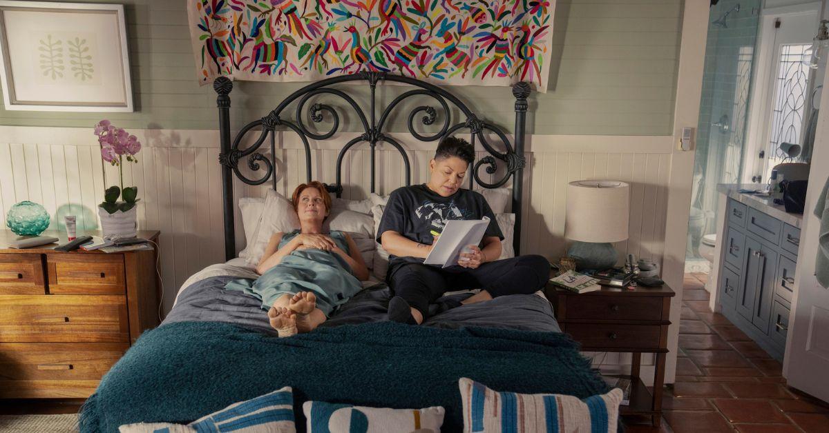 (l-r): Miranda and Che in bed while Che is highlighting their script