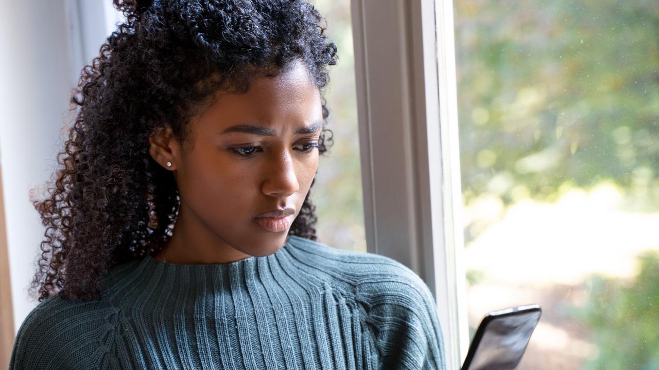 woman looking at phone