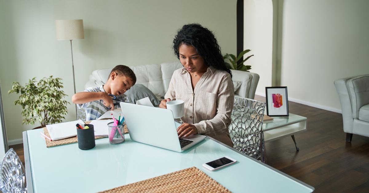 mom working at table with child