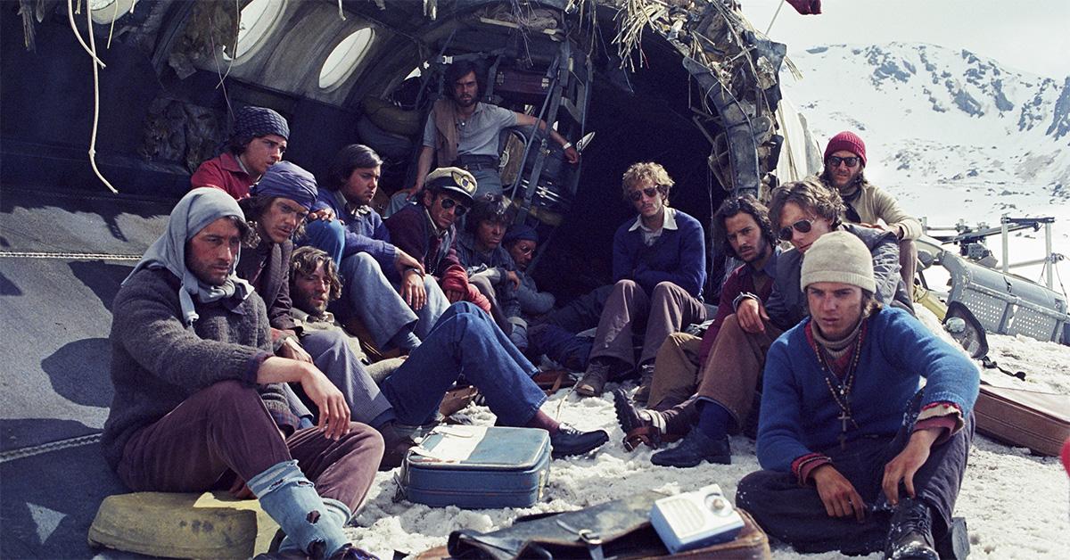 The cast of 'Society of the Snow' sitting in the fuselage. 