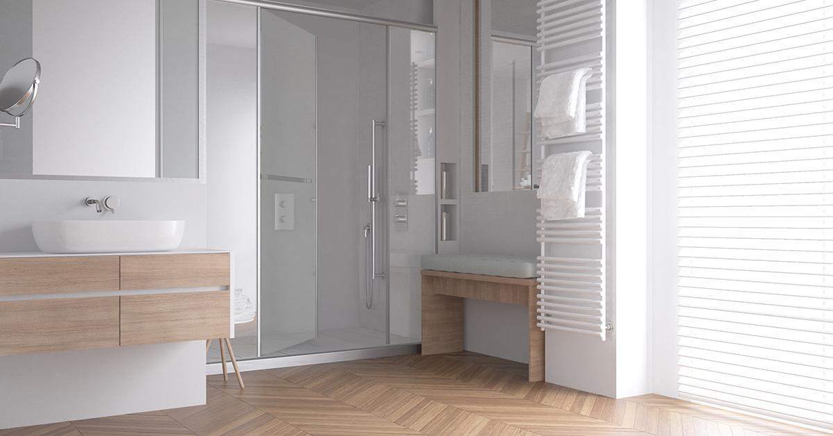 A glass shower door in a modern bathroom. 