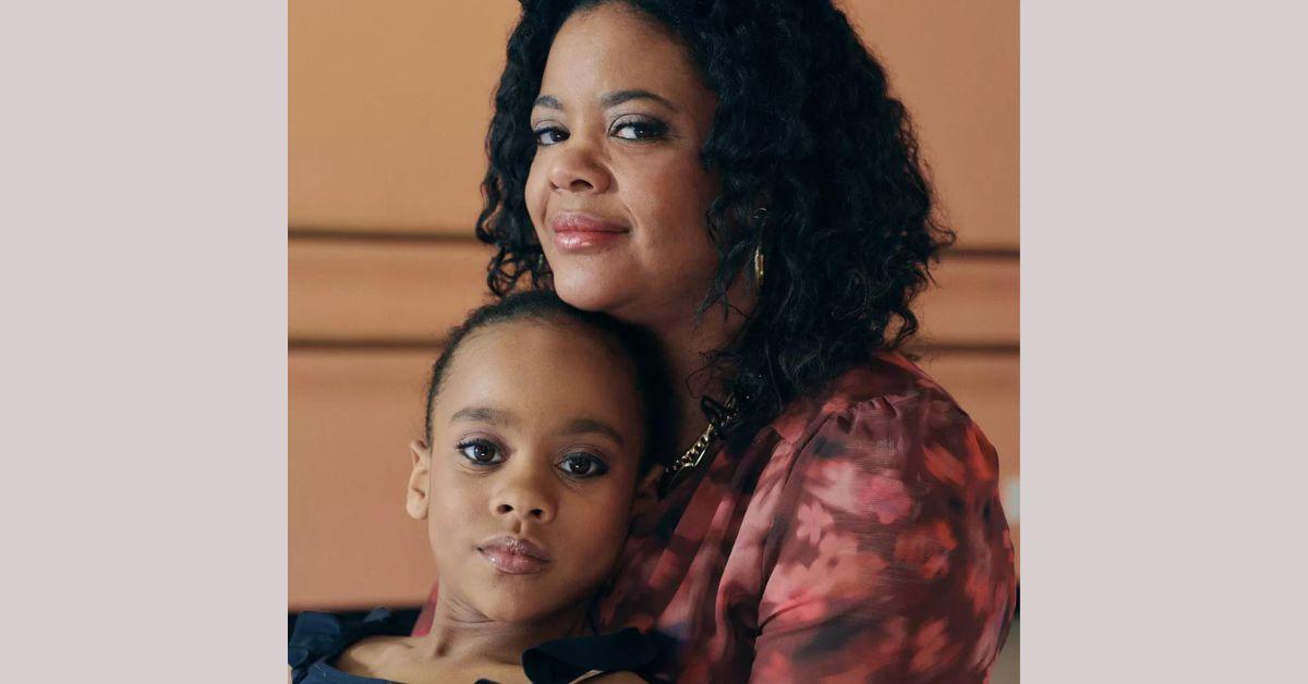 Leilah Bell seated on her mother's lap while Leslie rests her head atop her daughter's for for 'Dance Moms: A New Era' promo photo