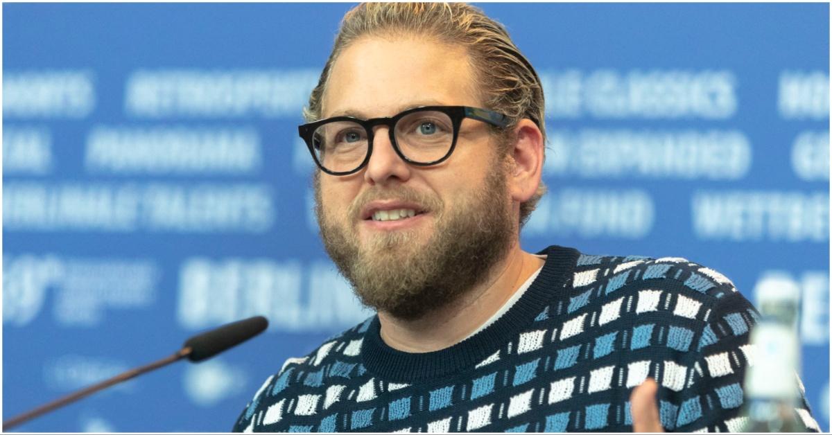 Jonah Hill talking into a microphone