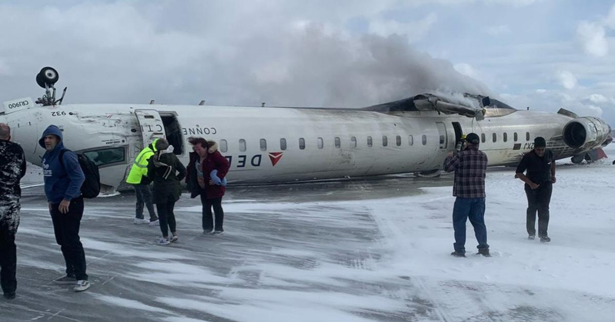 A photo of the Delta flight flipped upside down on the runway.