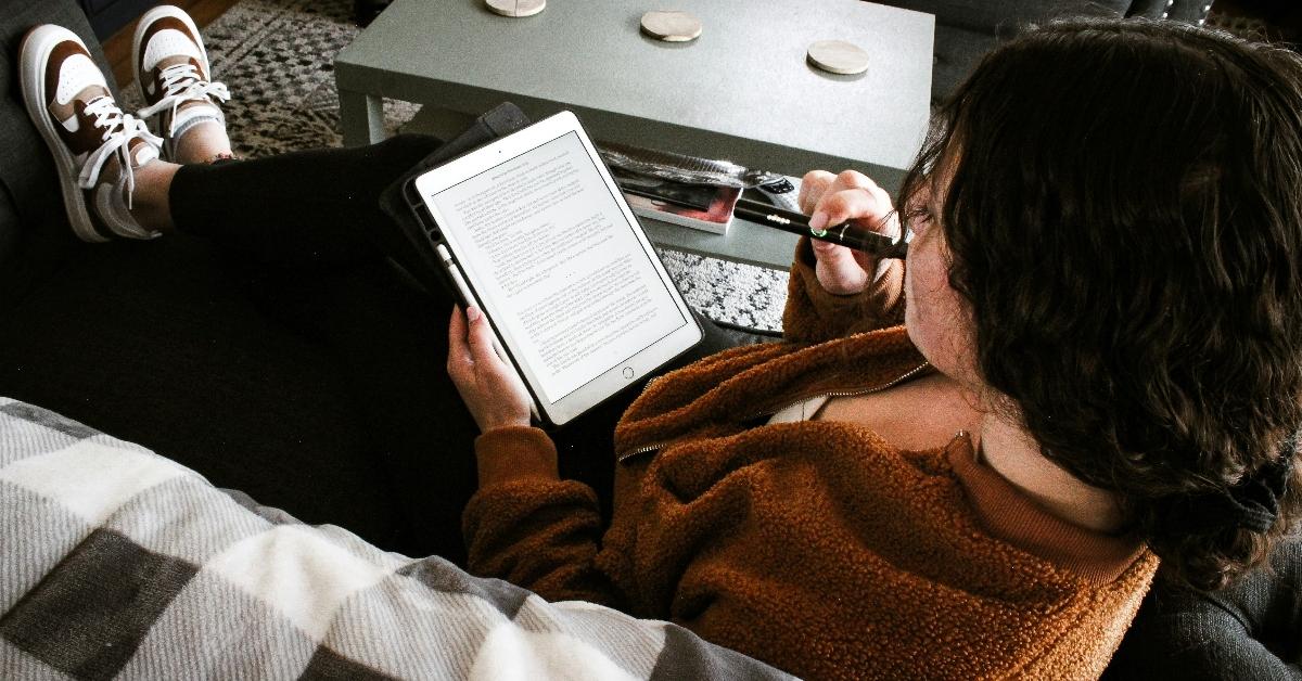 Woman reading a Kindle