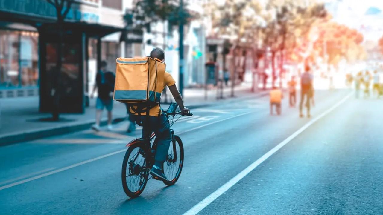 A delivery man on a bicycle