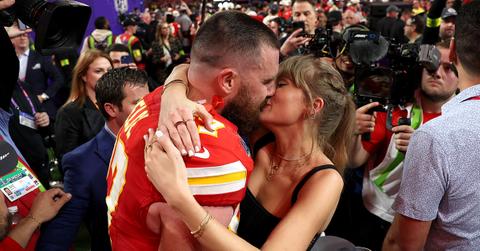 Travis Kelce kissing Taylor Swift after the Super Bowl.