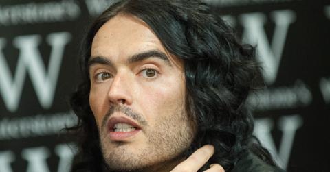 Russell Brand looking shocked at the camera