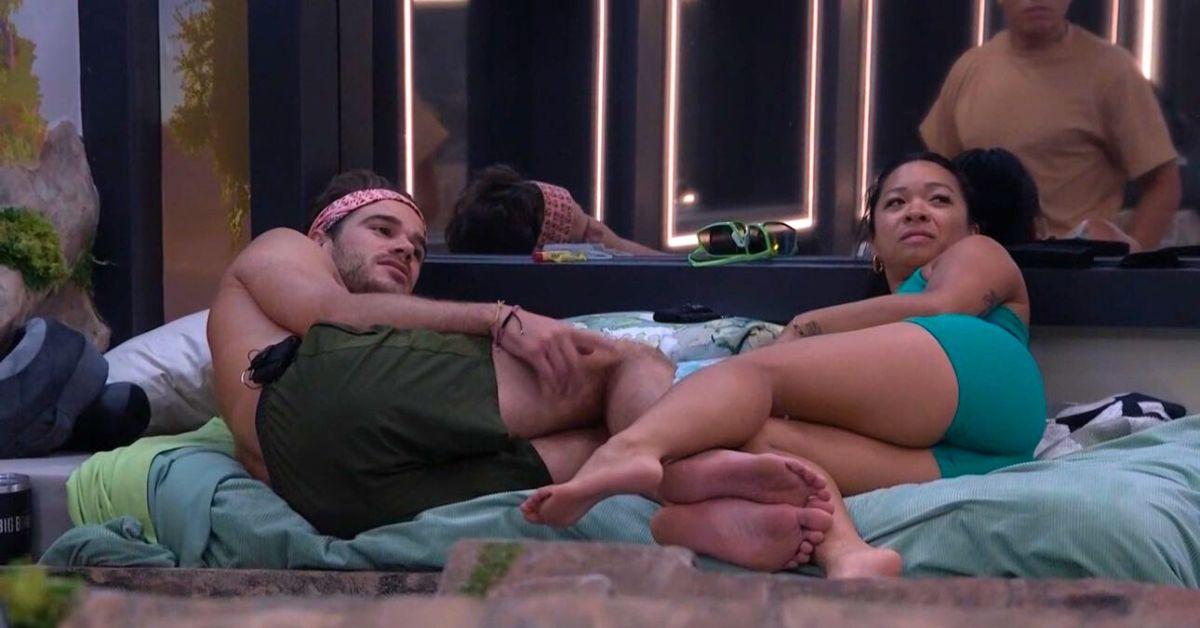 Tucker and Rubina (Tubina) lay on a bed with their legs interlocked on 'Big Brother 26'