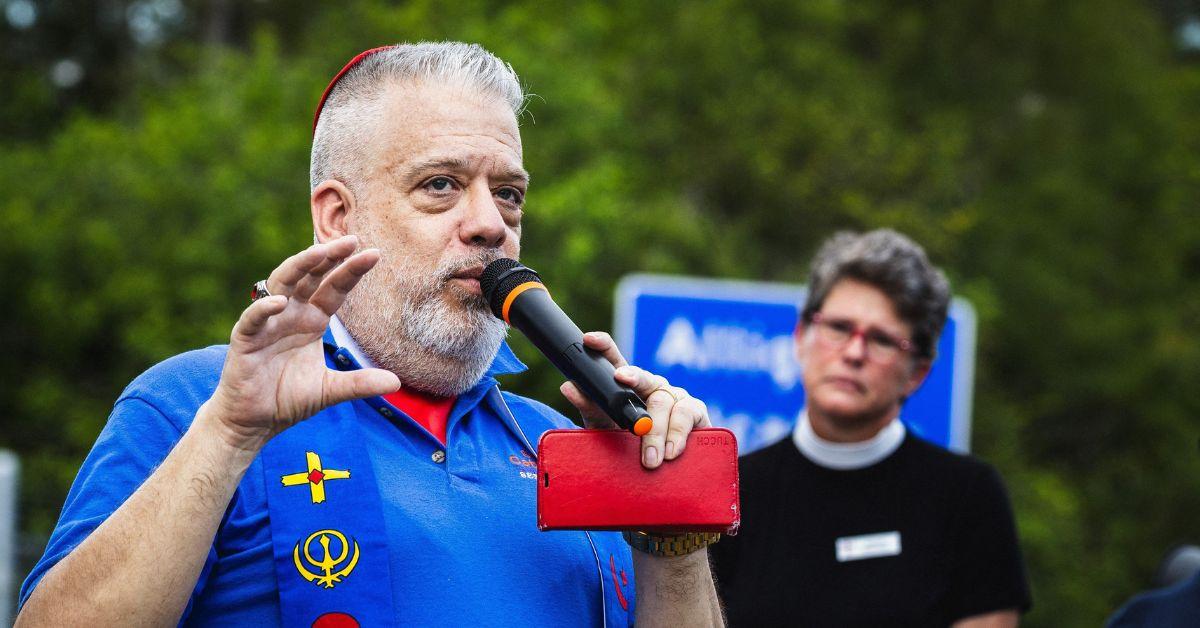A speaker at an Interfaith Vigil at Alligator Alcatraz.