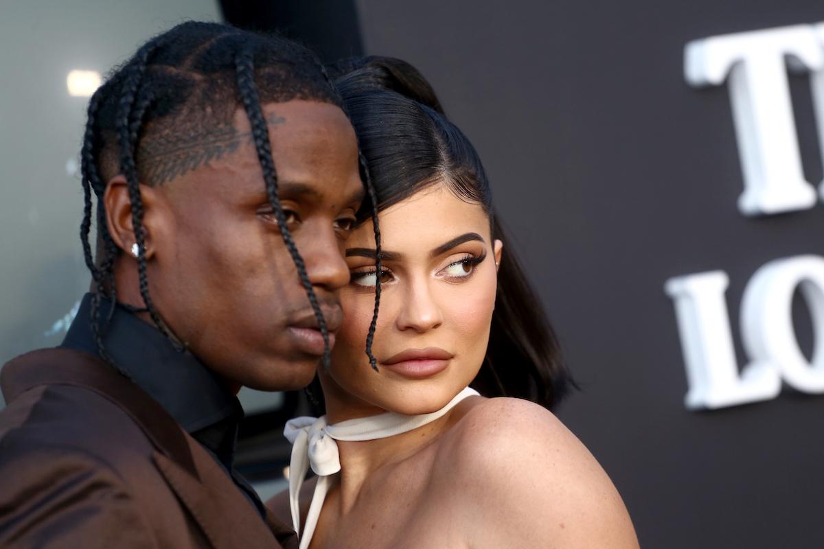 Travis Scott and Kylie Jenner in white dress at the premiere of Netflix's "Travis Scott: Look Mom I Can Fly" in August 2019