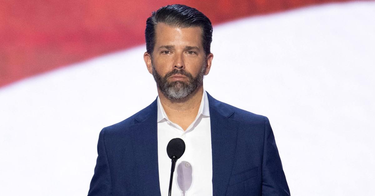 Donald Trump Jr giving a speech with a frown