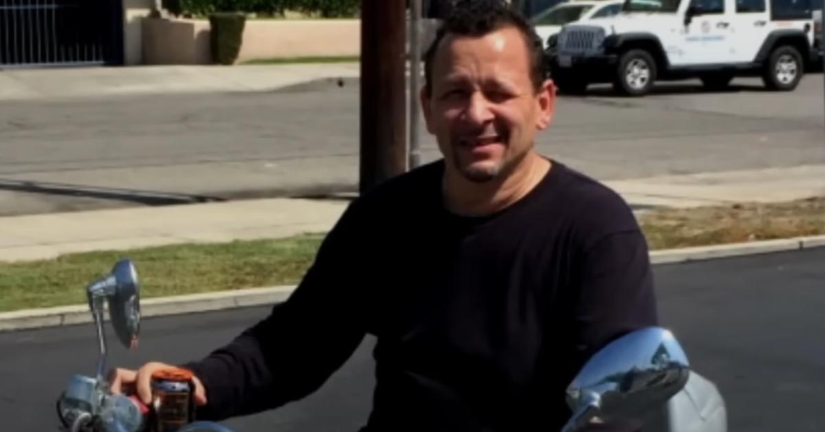 Robert Baker sits on a motorcycle