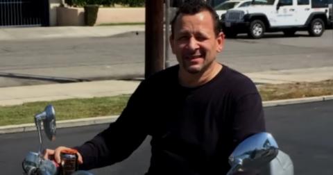 Robert Baker sits on a motorcycle