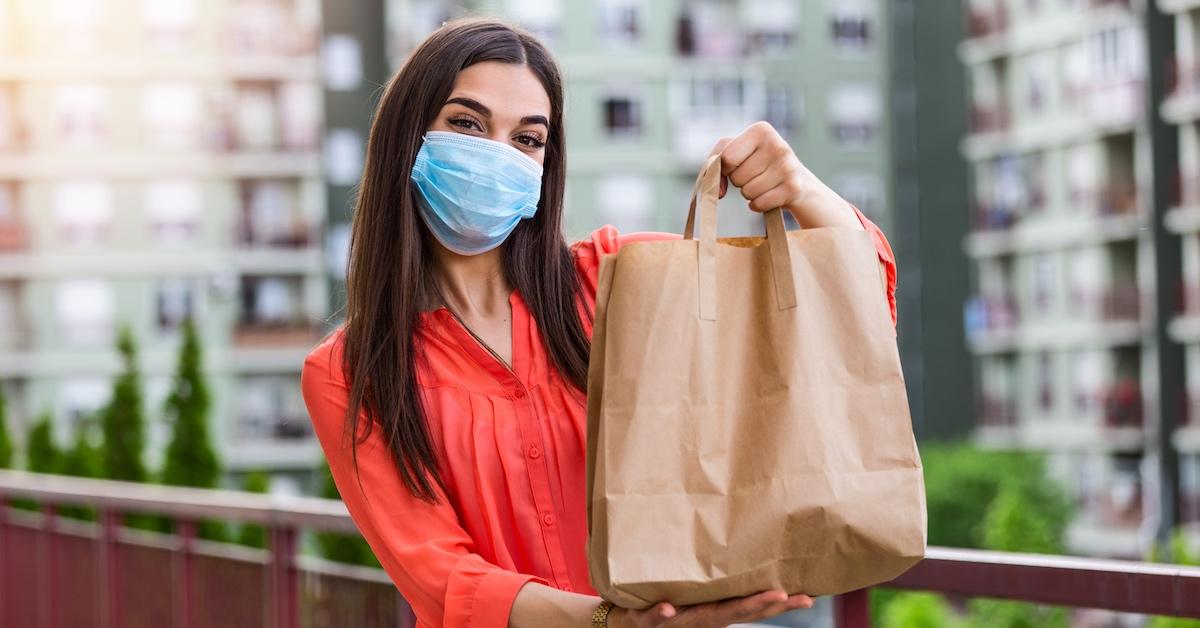 A female holding groceries