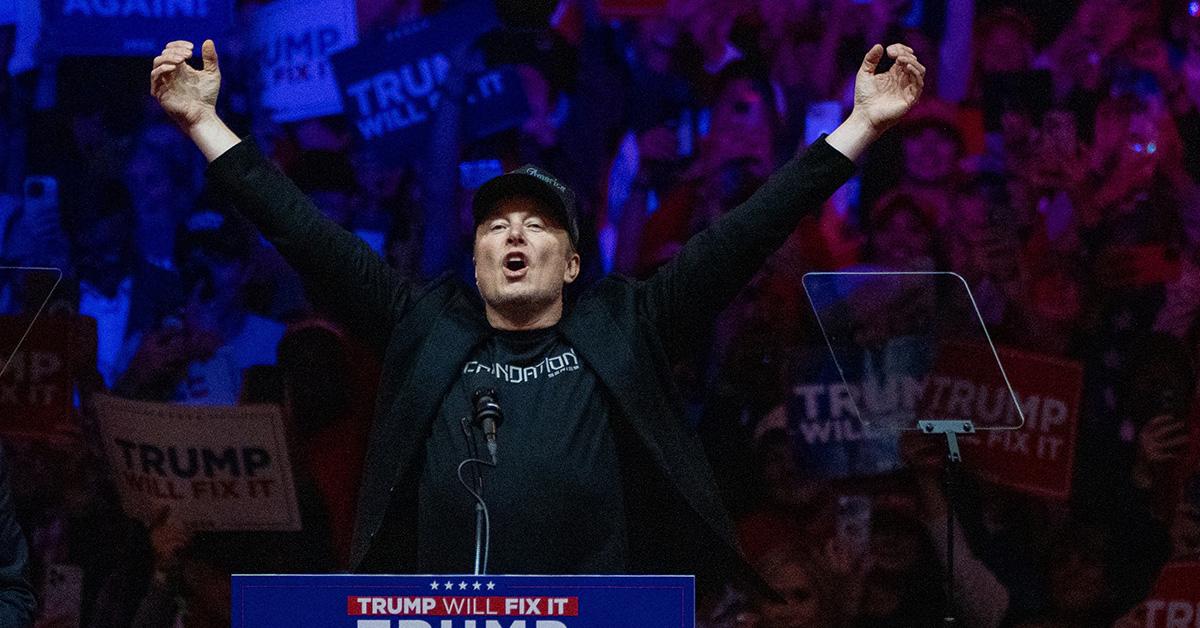 Elon Musk at Madison Square Garden with his fists in the air. 