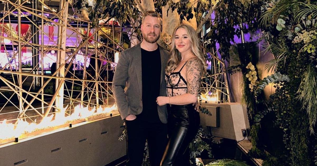 Nathan and Lauren pose outside at night in Las Vegas