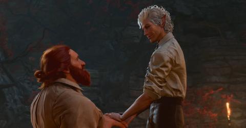 'Baldur's Gate 3' Astarion and Halsin holding hands.