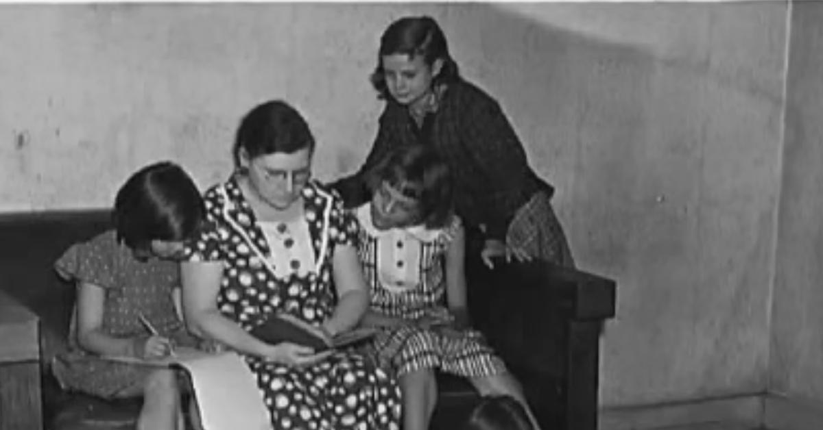 A teacher and her students during the Great Depression