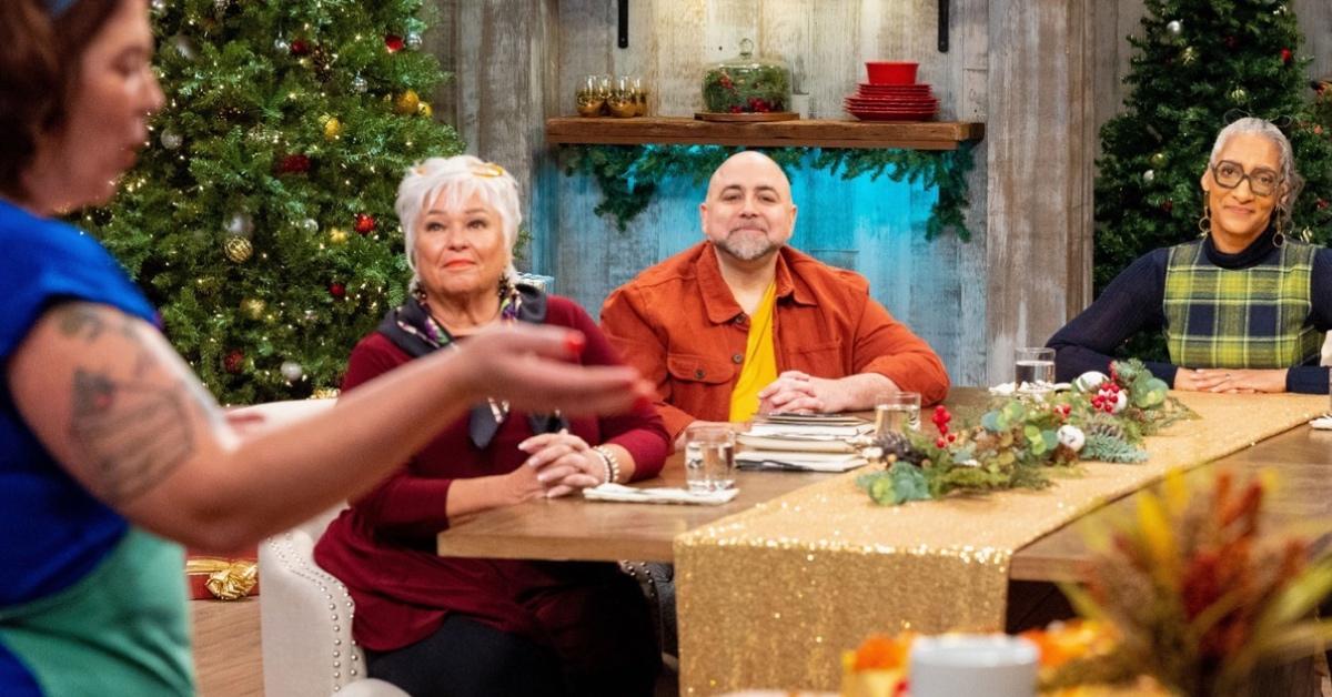 A 'Holiday Baking Championship' baker in front of the judges.