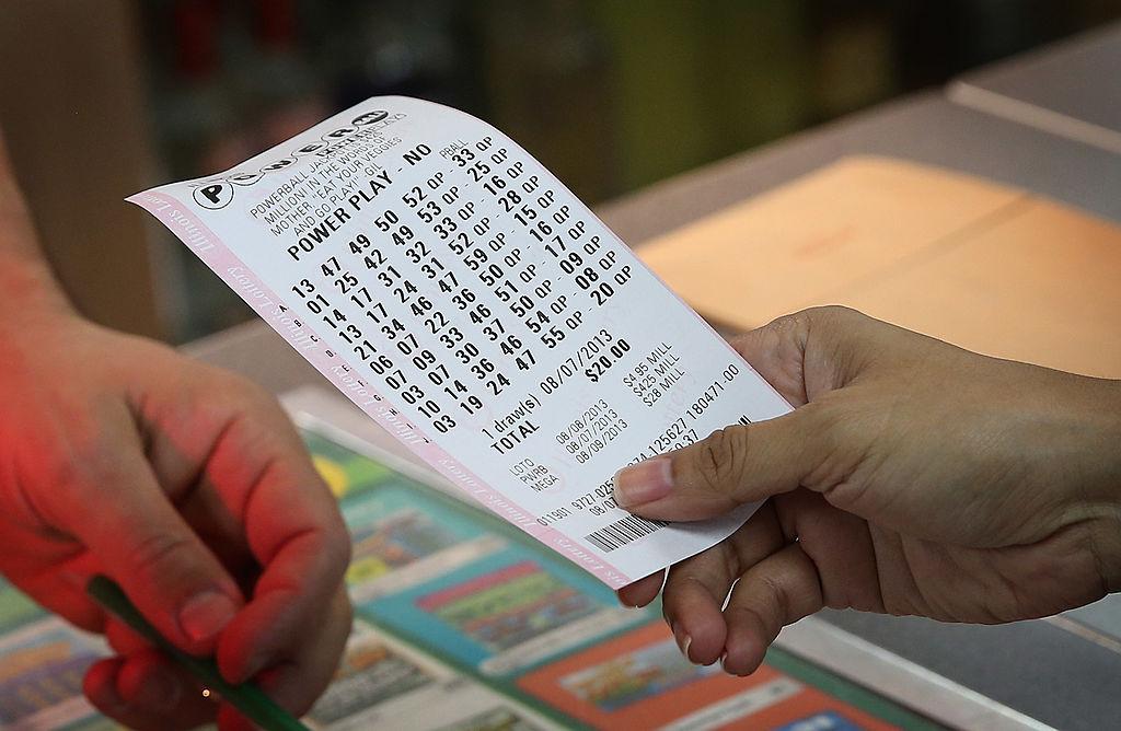 Man holding powerball ticket