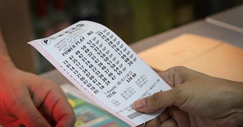 Man holding powerball ticket