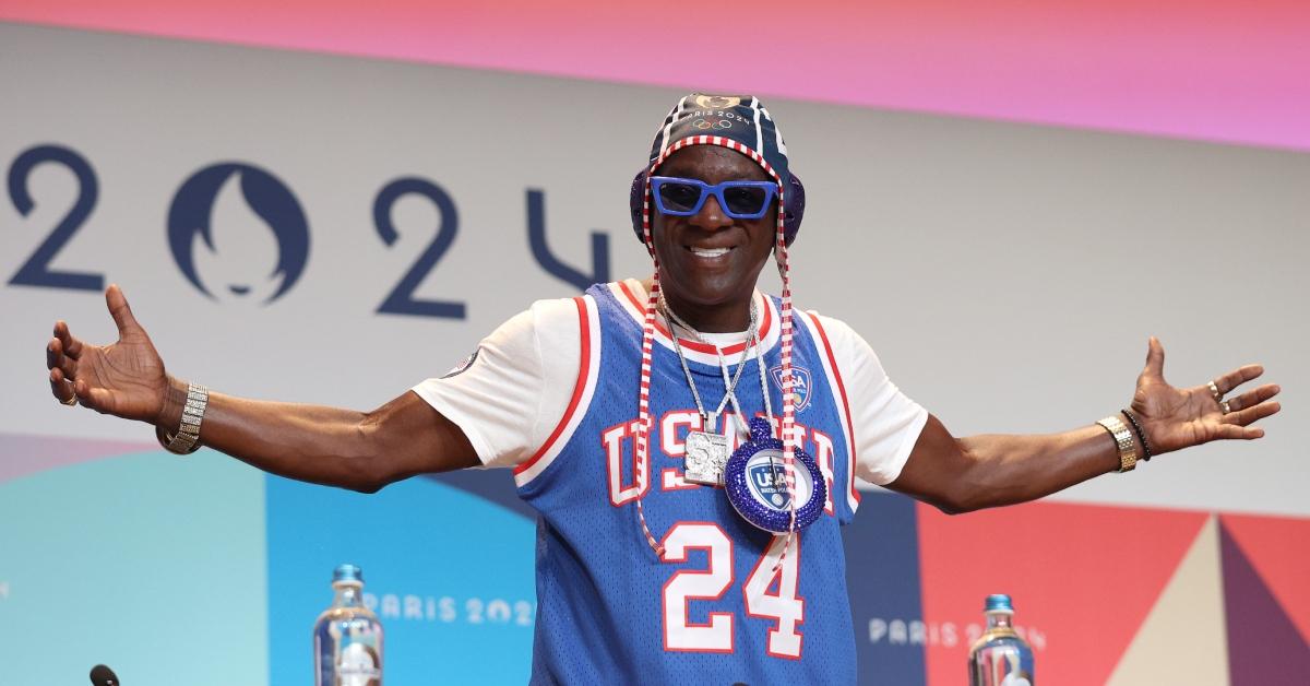 Flavor Flav wearing Maggie Steffens' sister-in-law's clock at the Team USA Water Polo press conference.