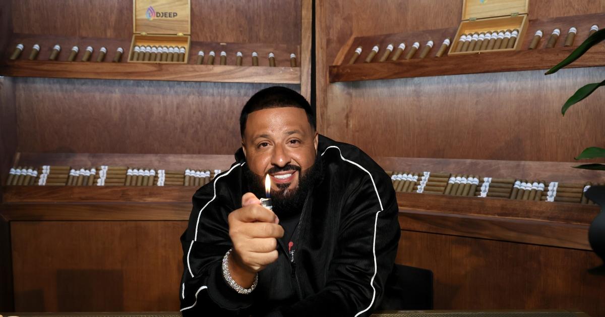 DJ Khaled holds a DJEEP lighter in a cigar shop. 