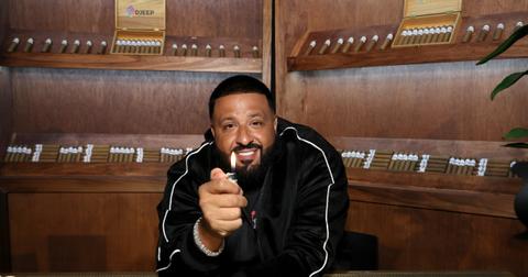 DJ Khaled holds a DJEEP lighter in a cigar shop.