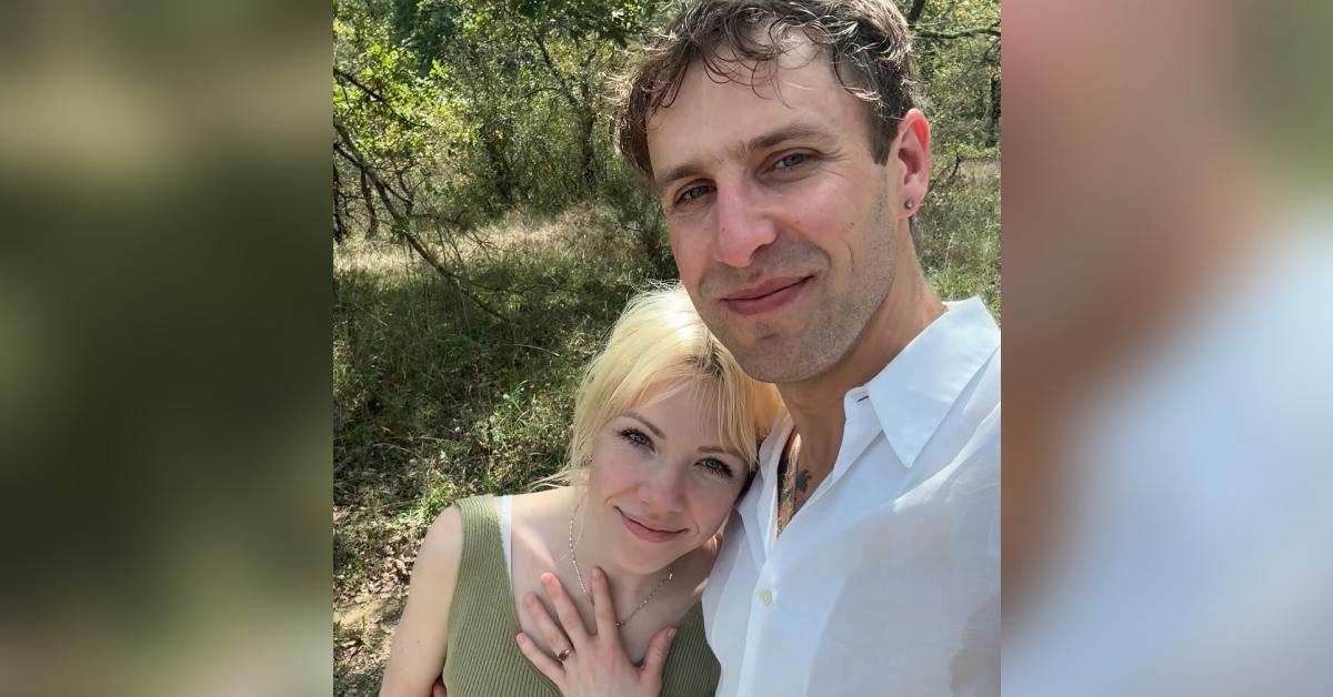 Carly Rae Jepsen showing off her engagement ring in a photo with her fiancé, Cole M.G.N.