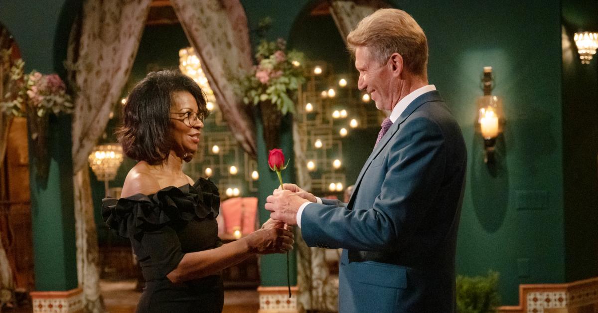 Gerry offers Sandra a rose during a 'Golden Bachelor' rose ceremony.