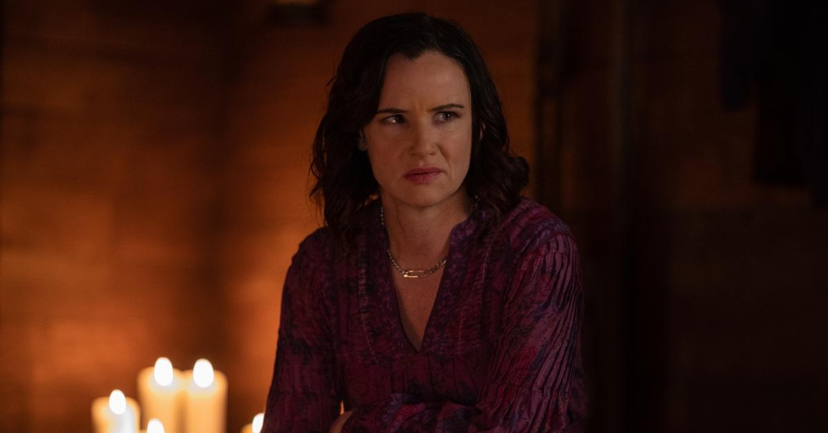 Juliette Lewis as Adult Natalie in Lottie's compound wearing the signature purple clothing. 