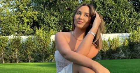 Catherine Paiz poses outside in a white dress