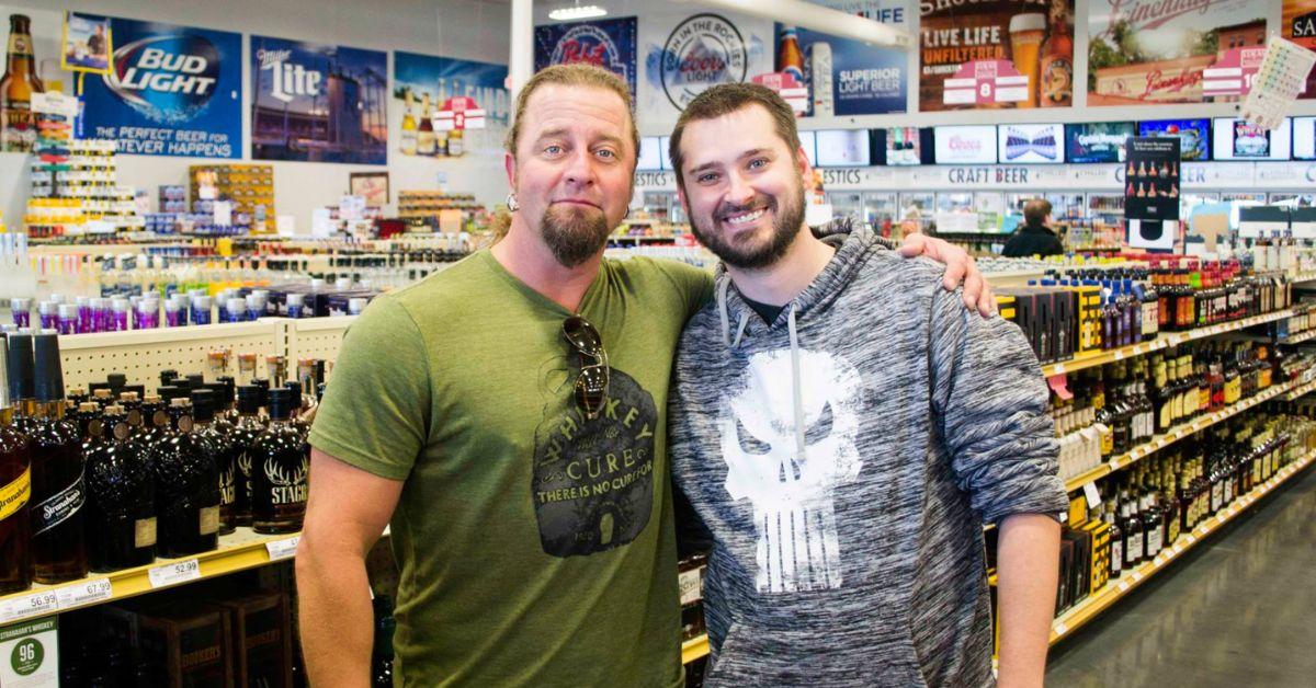 Johnny Dare with a fan at a liquor store. 