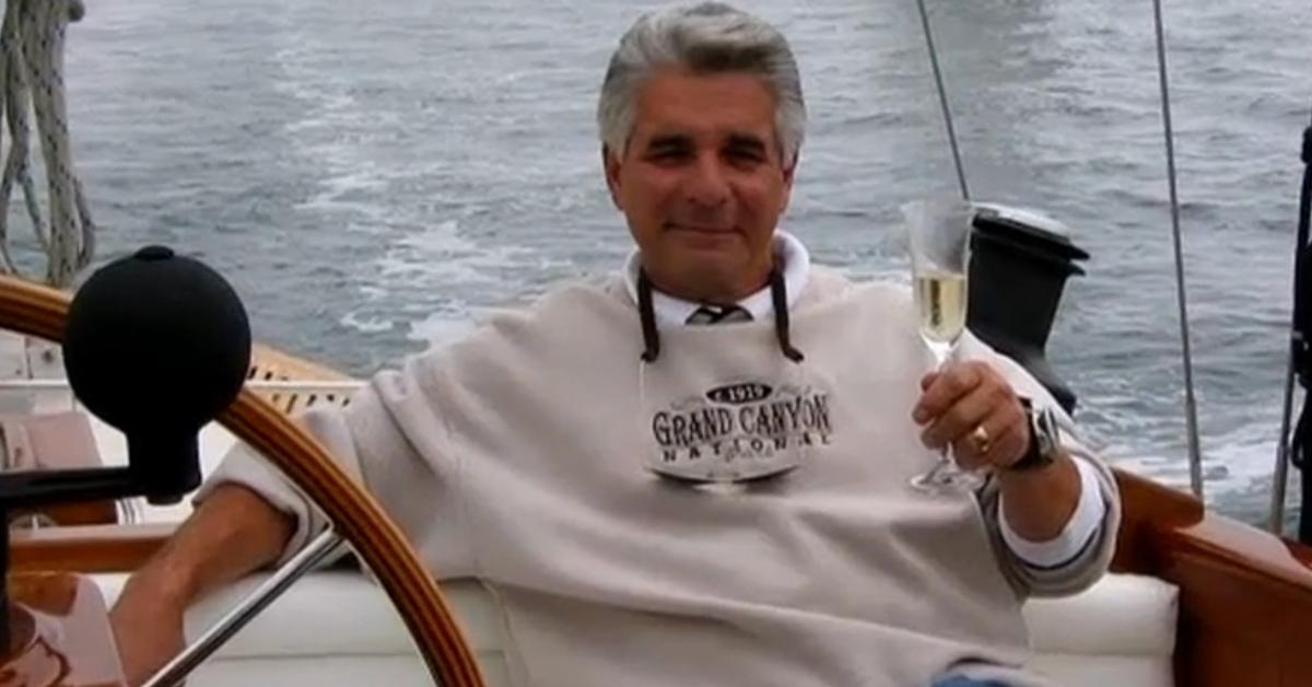 Harvey Morrow lounges on a boat while drinking champagne