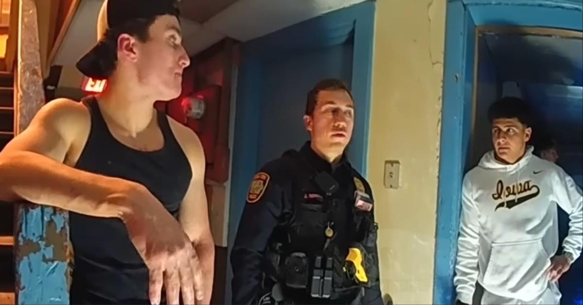 The police question Alpha Delta Phi Fraternity members at the University of Iowa.