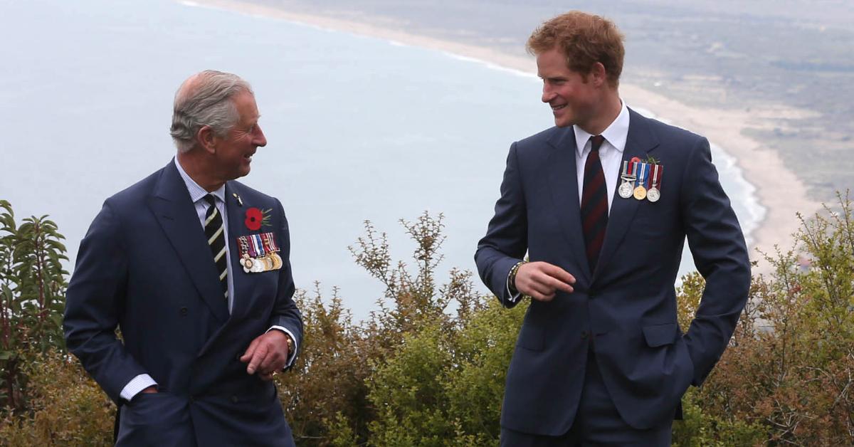 Prince Harry chats with his dad, King Charles, during a visit to The Nek on April 25, 2015, in Gallipoli, Turkey.