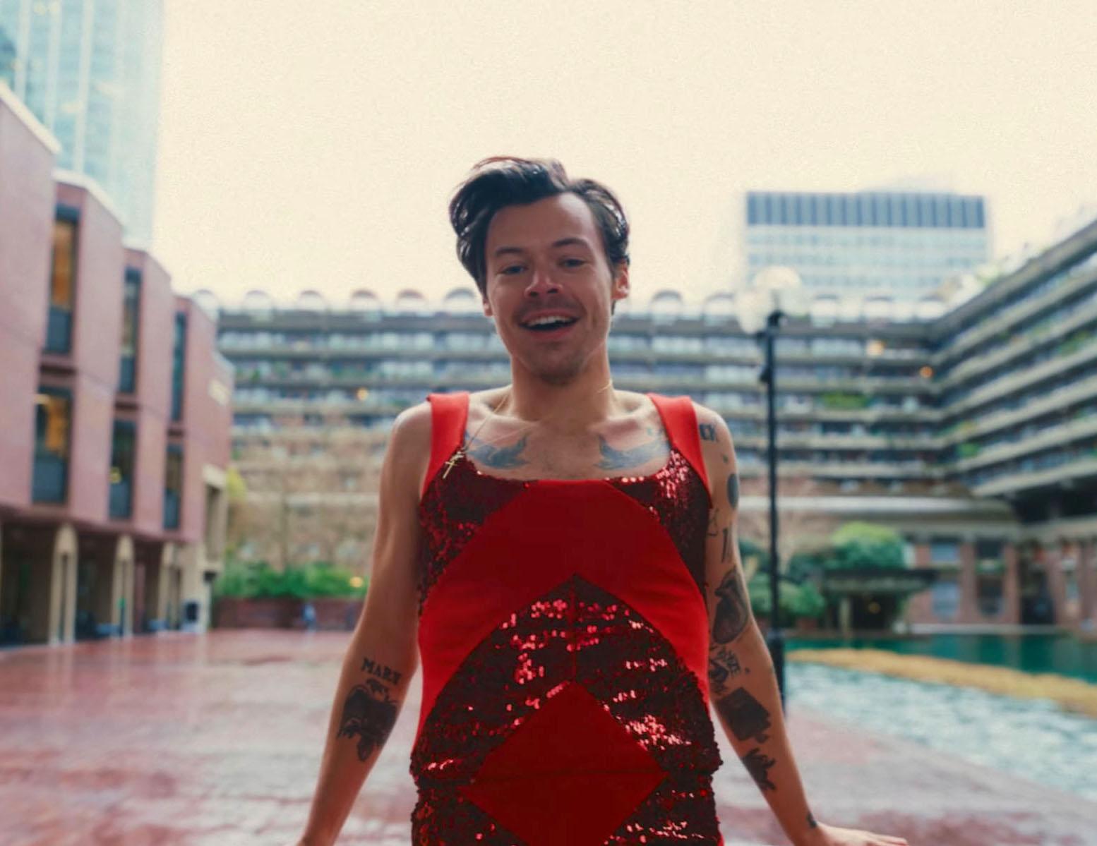 Harry Styles wears a red sequined jumpsuit in the music video for "As It Was"