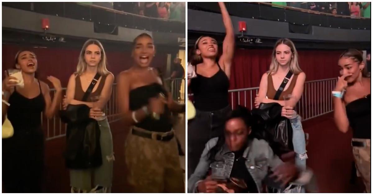 Bobbi Althoff looks unbothered as friends dance and cheer at a drake concert.