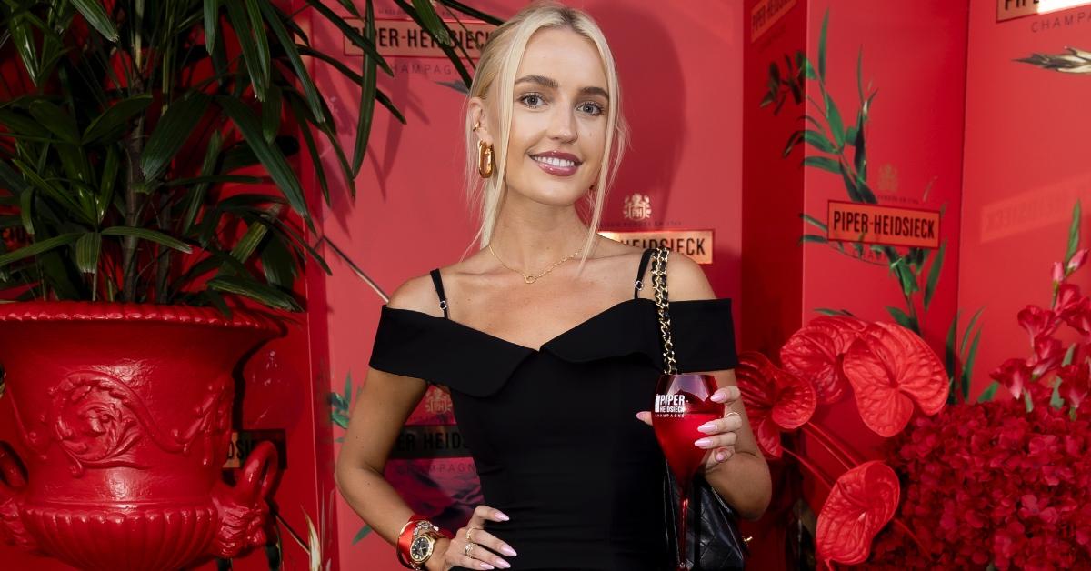 Morgan Riddle attends the Piper-Heidsieck AO24 launch event in a black dress.