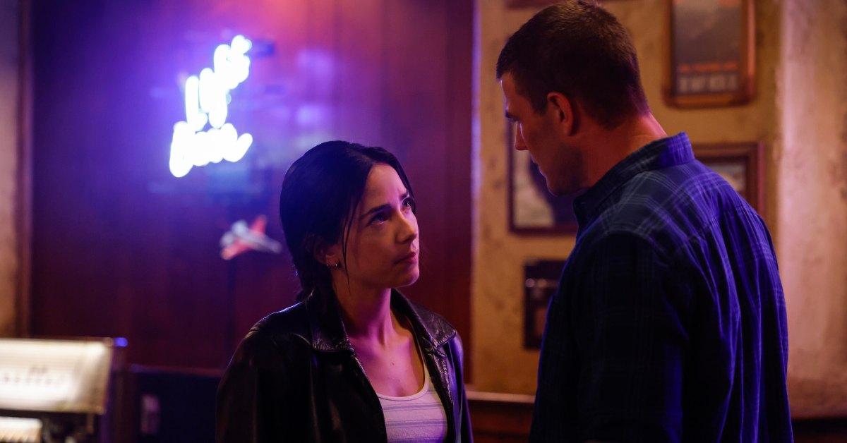 Lala and Gibbs having a moment in a bar.