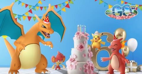 'Pokémon GO' Promo art of Charizard and other creatures standing around a birthday cake.