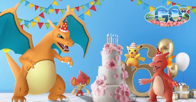 'Pokémon GO' Promo art of Charizard and other creatures standing around a birthday cake.