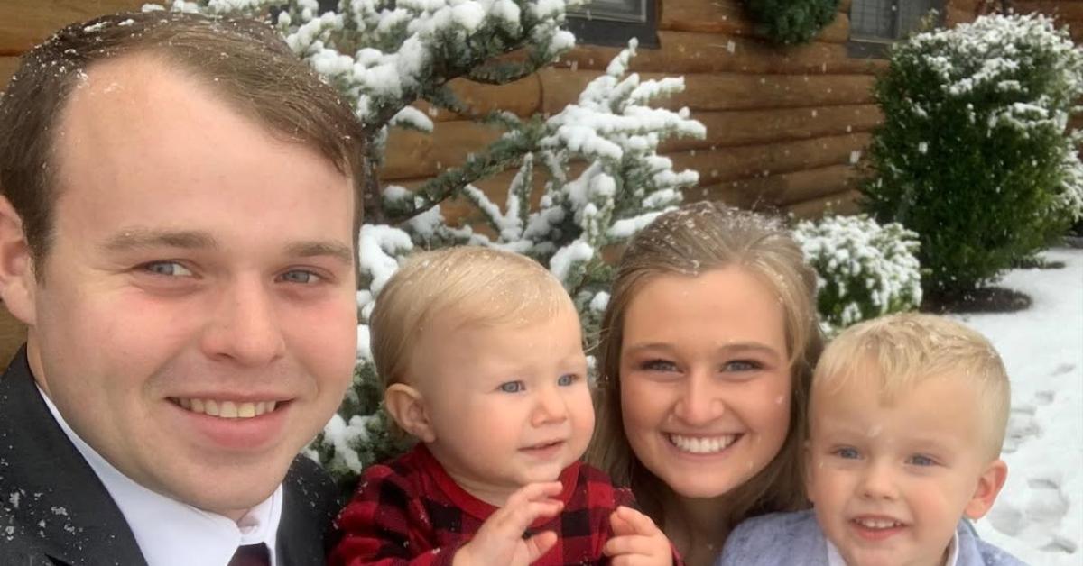 Joseph Duggar with his wife and two kids in the snow.