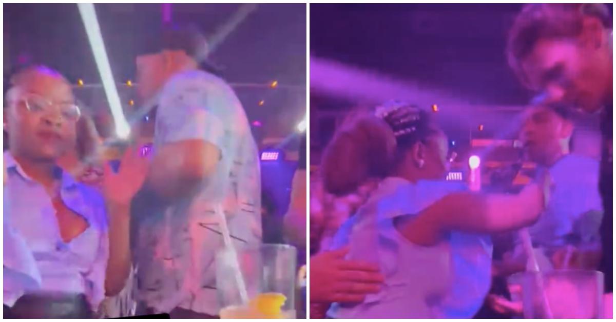 Woman looks frustrated and pushes a man away after he spilled her drink and allegedly tried to roofie her.